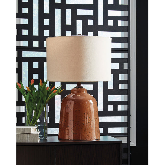 A room setting featuring Aaleahya Rust Table Lamp