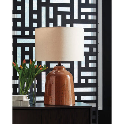 A room setting featuring Aaleahya Rust Table Lamp