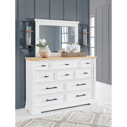 A room setting featuring Ashbryn White Mirror