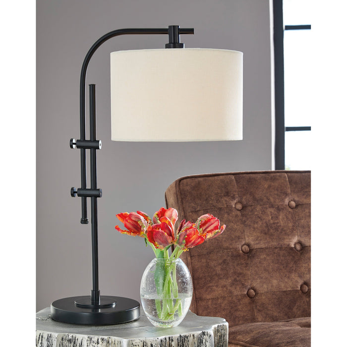 A room setting featuring Baronvale Black Accent Table Lamp
