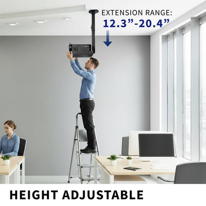 Person using a height-adjustable extension projector tray in an office setting.