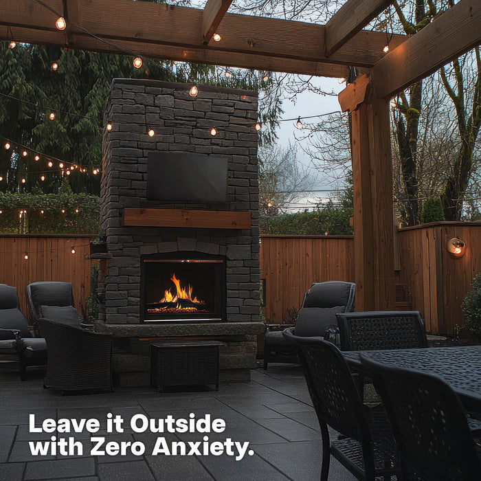 Outdoor patio with stone fireplace with a TV with TV protective cover featuring text 'Leave it Outside with Zero Anxiety'.