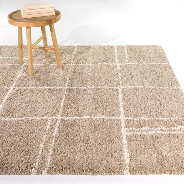 A room setting featuring Hardin Beige 5x8 Abstract Area Rug