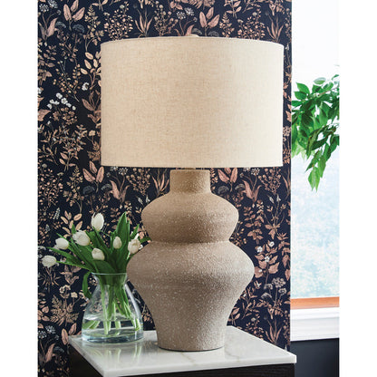 A room setting featuring Jossleigh Beige Table Lamp