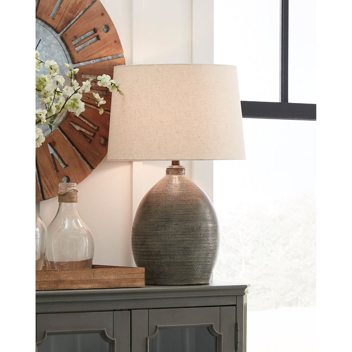 A room setting featuring Joyelle Gray Table Lamp