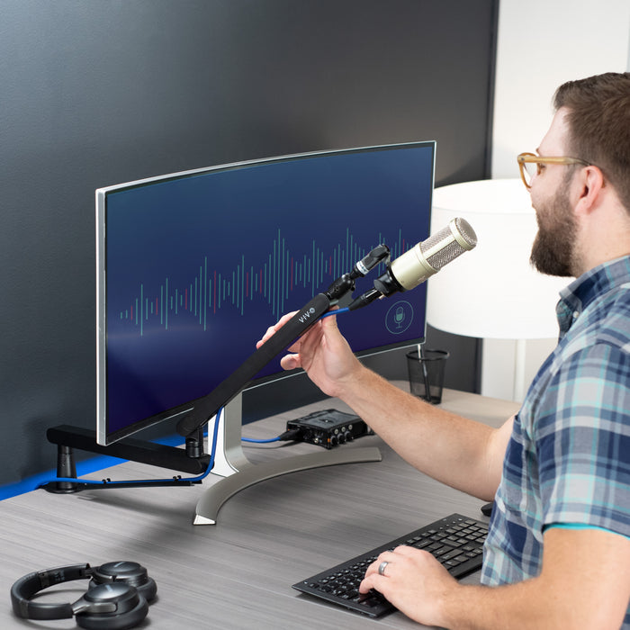 Low height adjustable clamp-on microphone arm desk mount.