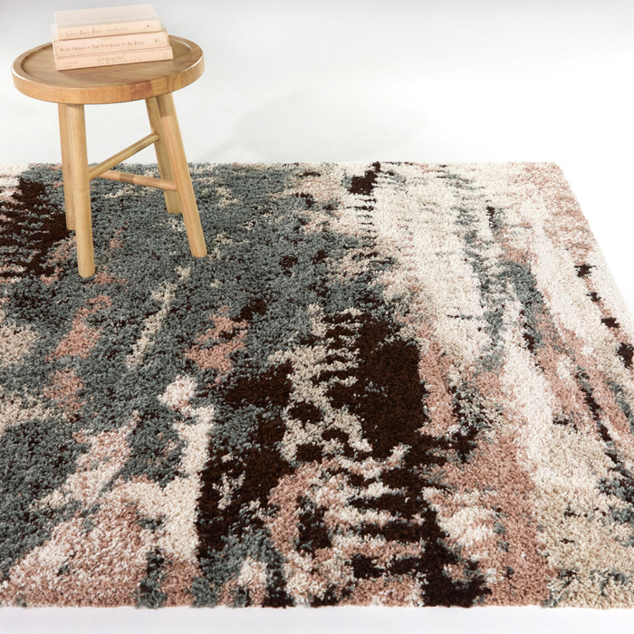 A room setting featuring Macleod Cream 5x8 Abstract Area Rug