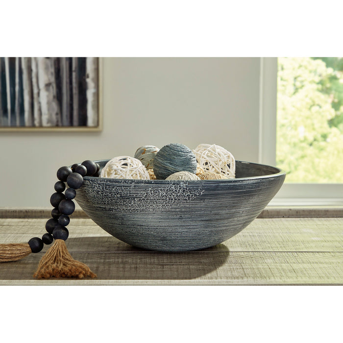 A room setting featuring Meadie Distressed Blue Bowl