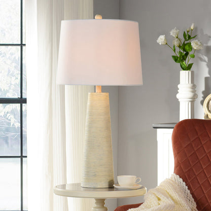 A room setting featuring Michel Washed White Table Lamp