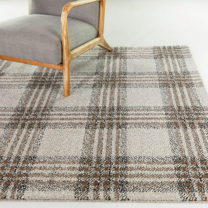 A room setting featuring Monte Brown 5x8 Plaid Area Rug