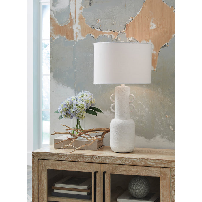 A room setting featuring Perringhill Distressed White Table Lamp
