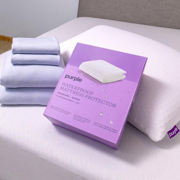A room setting featuring Purple Standard Twin Mattress Protector