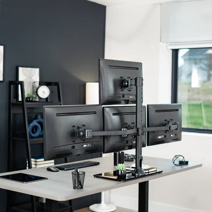 Sturdy height adjustable quad monitor desk stand.