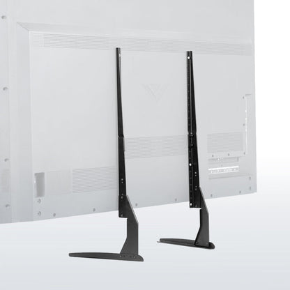 Two black TV stands against a white wall with a textured pattern.