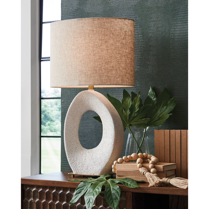 A room setting featuring Trentlen Cream Table Lamp