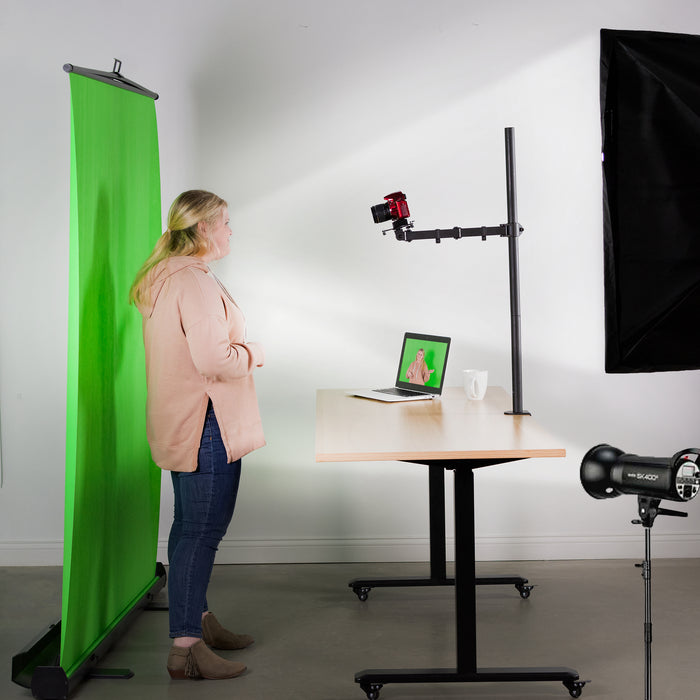 Universal camera mount being used with a green screen.