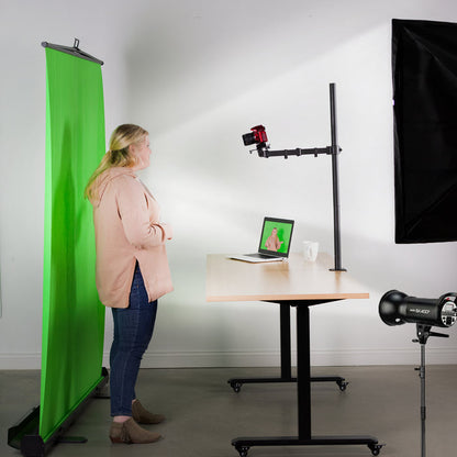 Universal camera mount being used with a green screen.