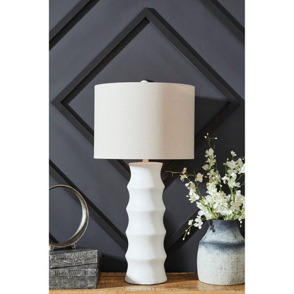 A room setting featuring Veraleigh White Table Lamp