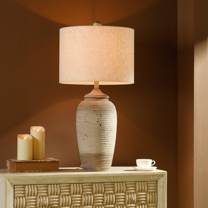 A room setting featuring Waylin Cream Table Lamp